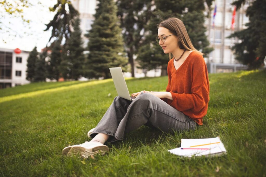 a-student-in-the-park-is-studying-campus-student-life-distance-learning-remotely-working-online.jpg